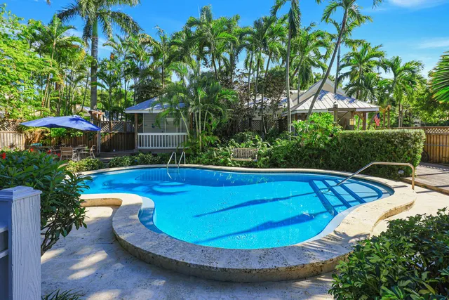 a view of a swimming pool with a patio