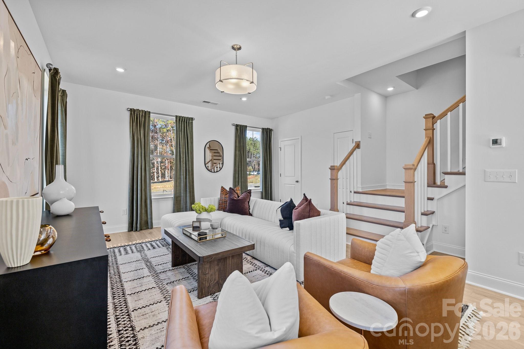 3025 Rozzelles Ferry Road Charlotte, NC 28208 - Photo 13 of 23 a living room with furniture and wooden floor