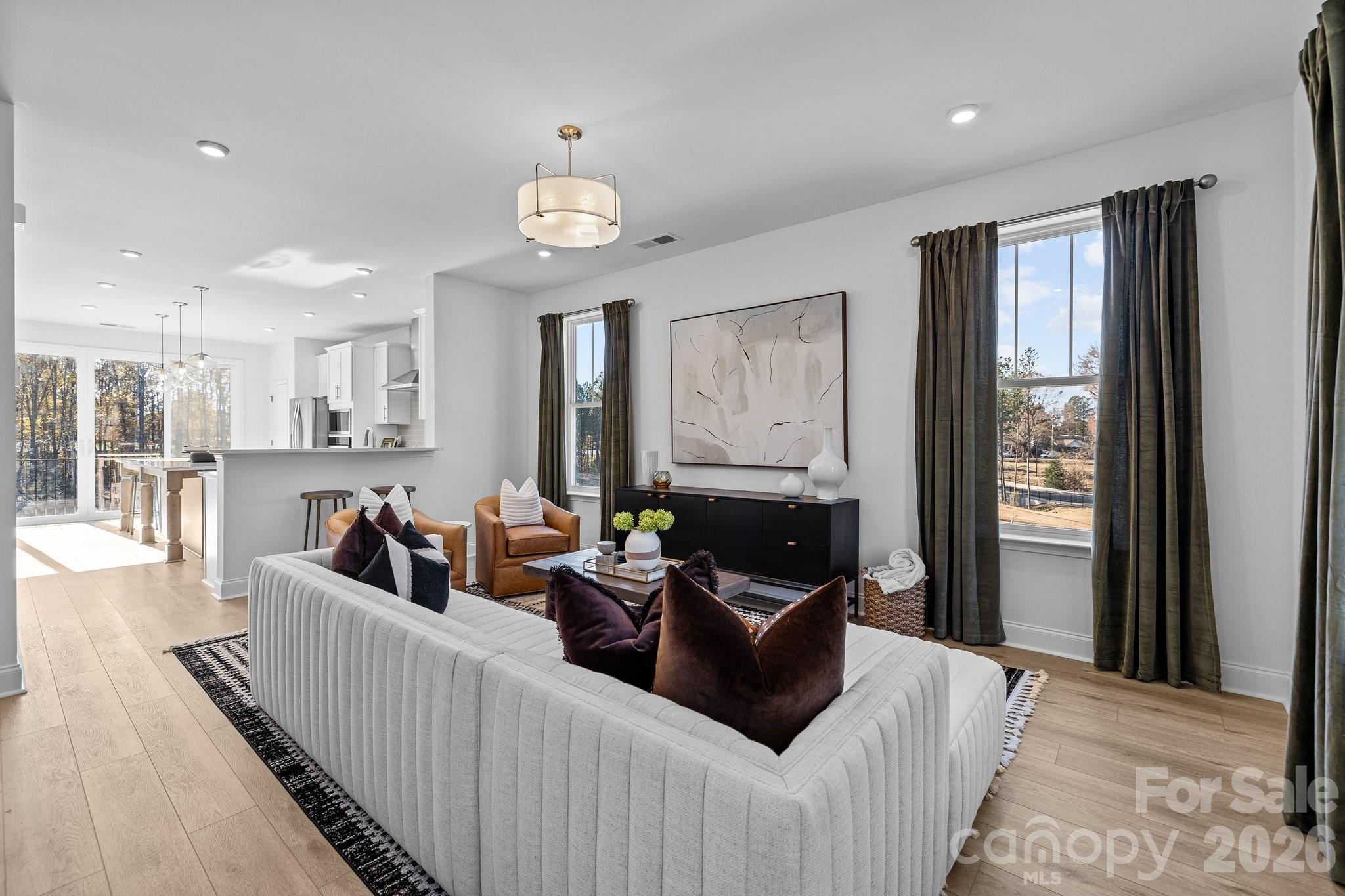 3025 Rozzelles Ferry Road Charlotte, NC 28208 - Photo 17 of 26 a living room with furniture and a large window