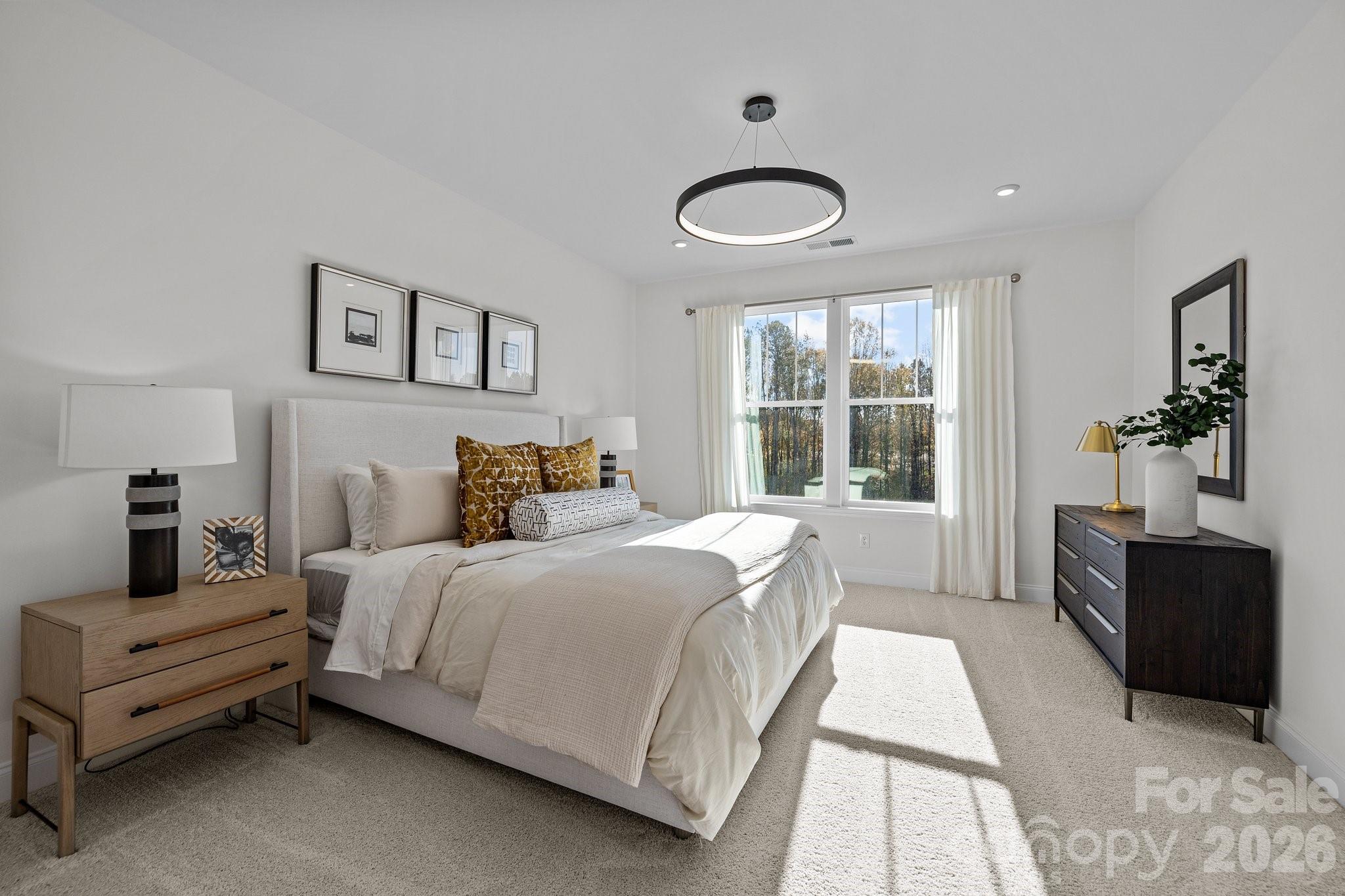 3025 Rozzelles Ferry Road Charlotte, NC 28208 - Photo 19 of 26 a bedroom with a bed and a large window