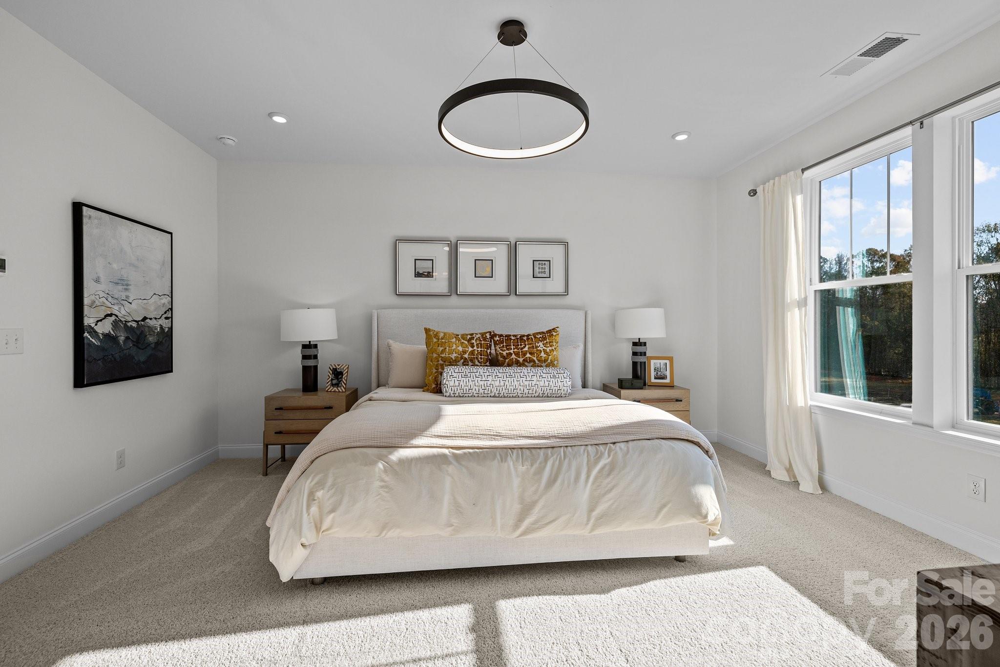 3025 Rozzelles Ferry Road Charlotte, NC 28208 - Photo 20 of 26 a bedroom with a large bed and a window