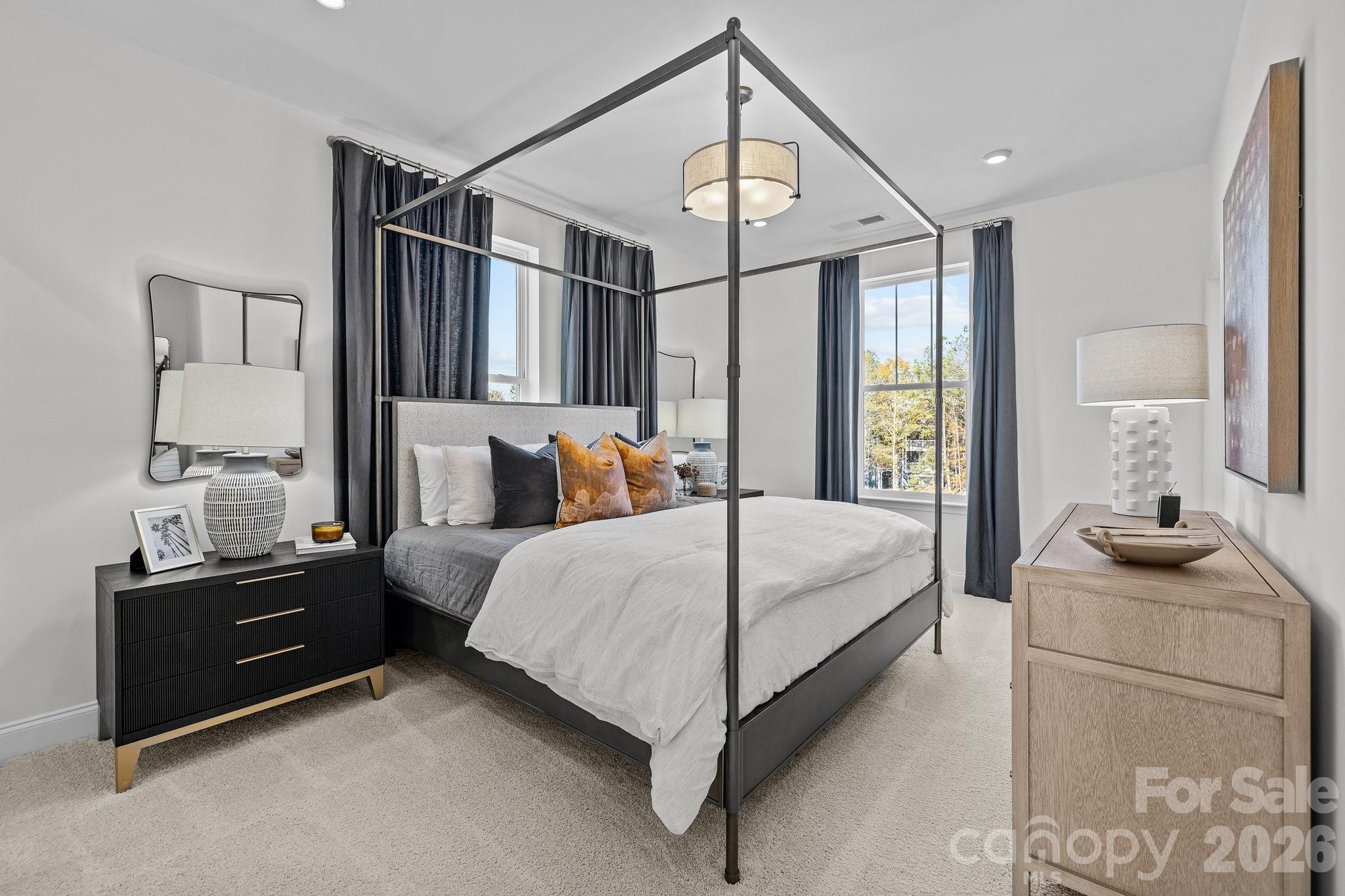 3025 Rozzelles Ferry Road Charlotte, NC 28208 - Photo 20 of 23 a bedroom with a bed a dresser and next to a window