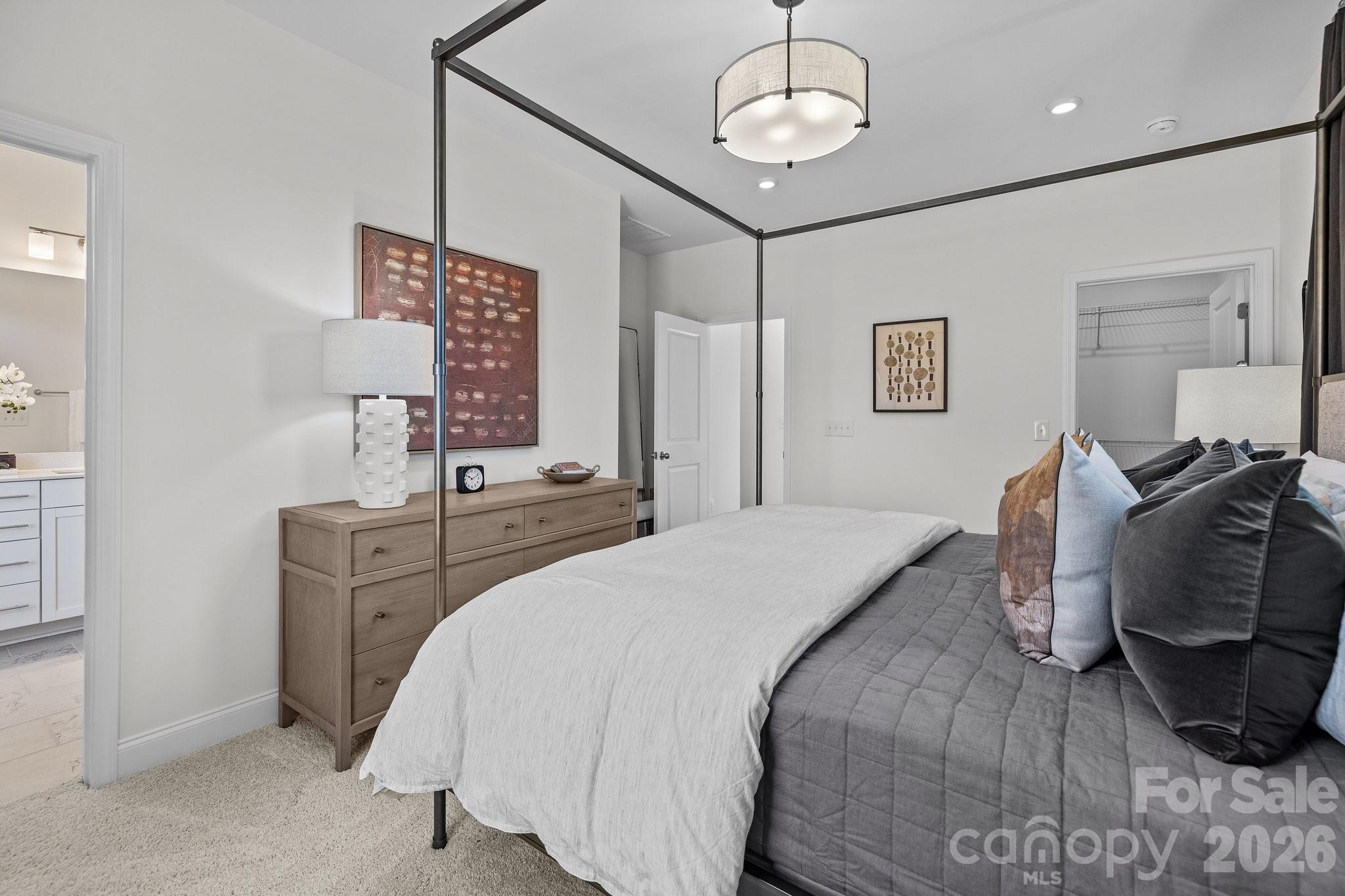 3025 Rozzelles Ferry Road Charlotte, NC 28208 - Photo 21 of 23 a bedroom with a bed and wooden floor