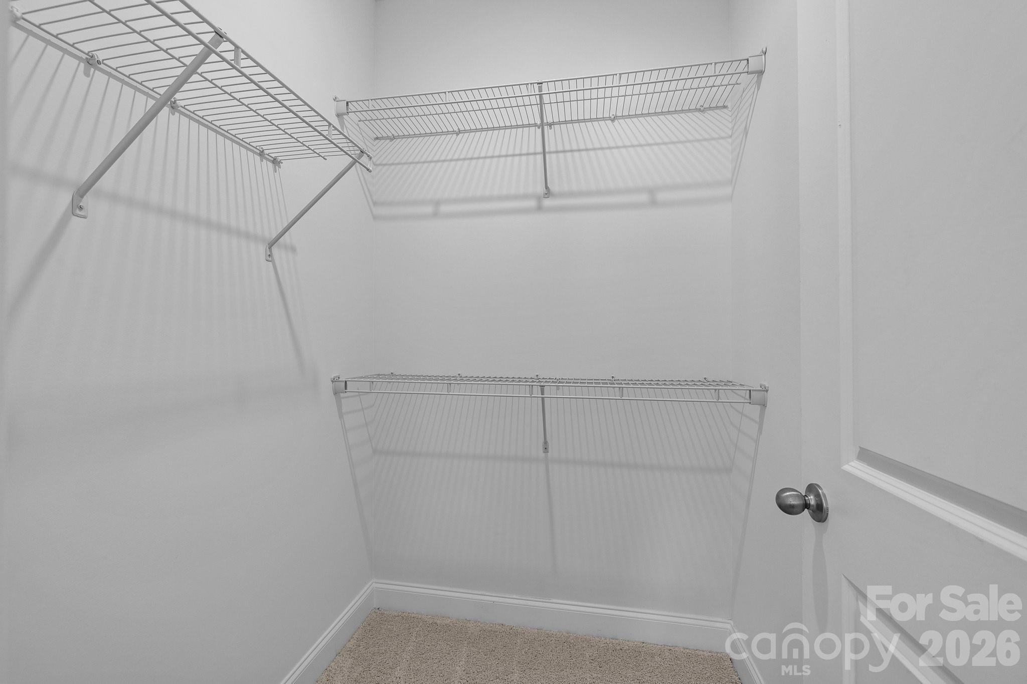3025 Rozzelles Ferry Road Charlotte, NC 28208 - Photo 22 of 23 a view of a room with racks on the wall