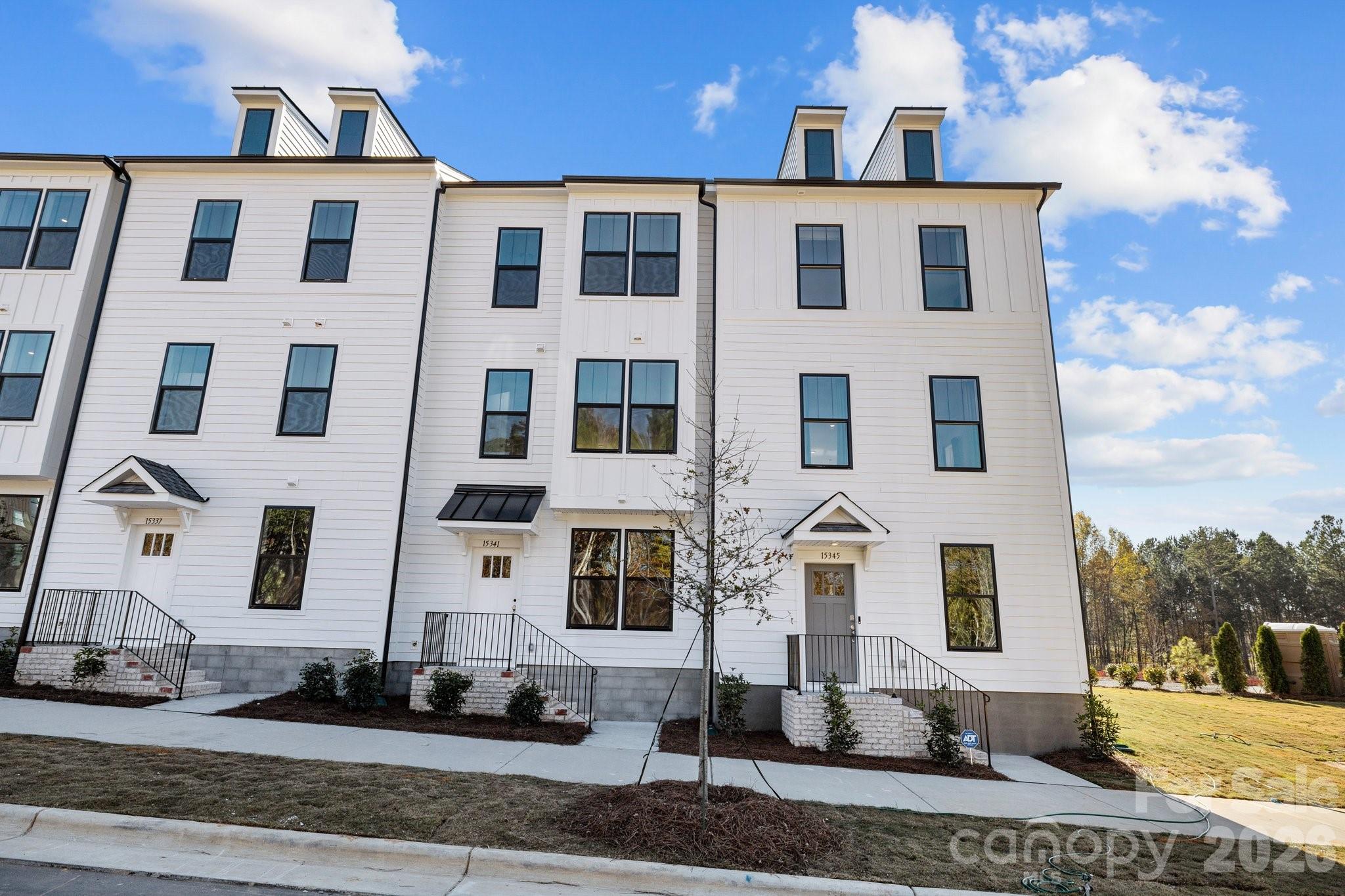 3025 Rozzelles Ferry Road Charlotte, NC 28208 - Photo 23 of 23 a front view of a house with a yard