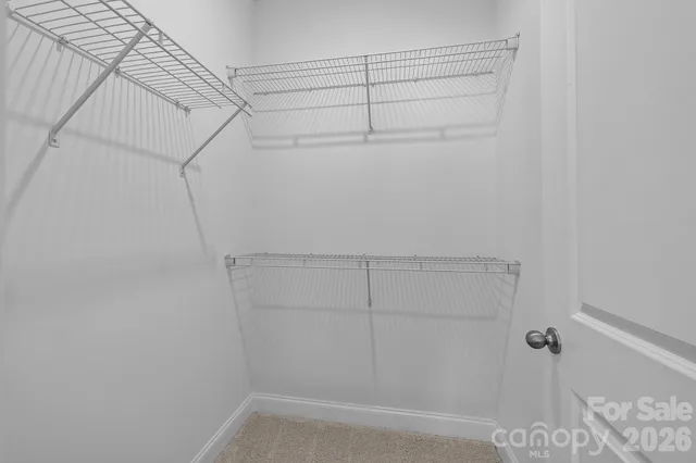 a view of a room with racks on the wall