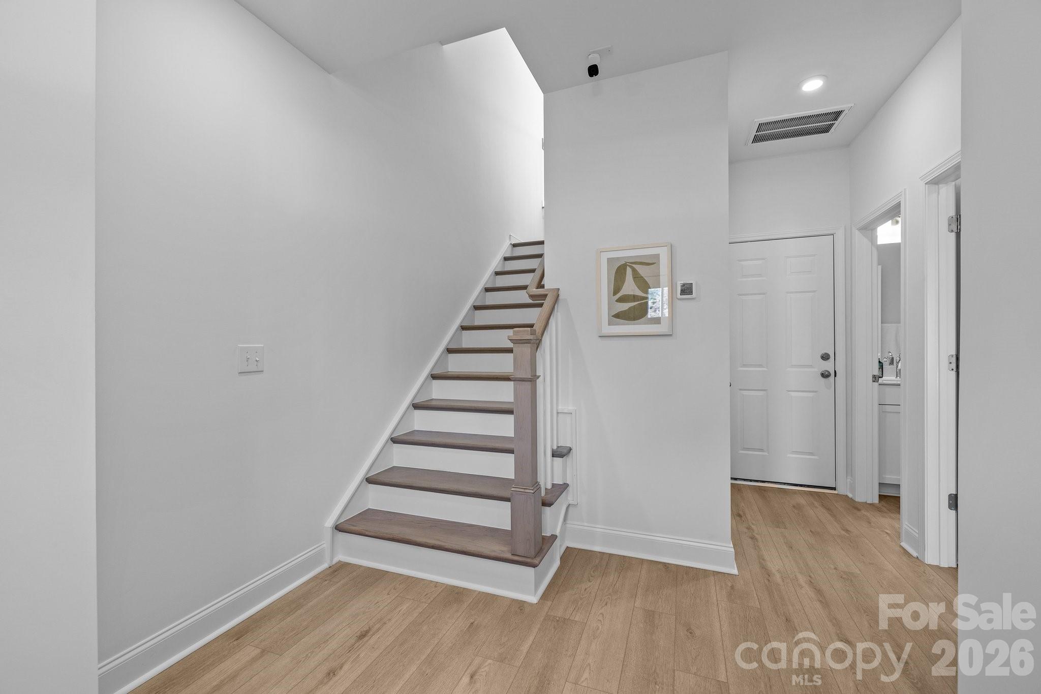 3025 Rozzelles Ferry Road Charlotte, NC 28208 - Photo 7 of 26 a view of entryway with wooden floor