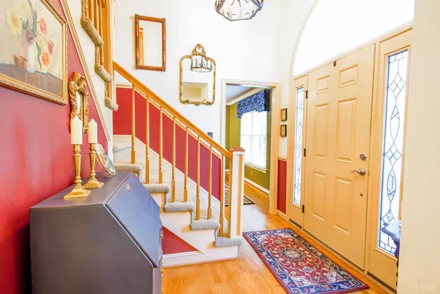 a view of an entryway with wooden floor