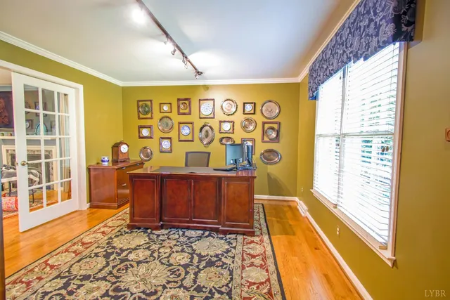 a view of a livingroom with furniture and a bedroom