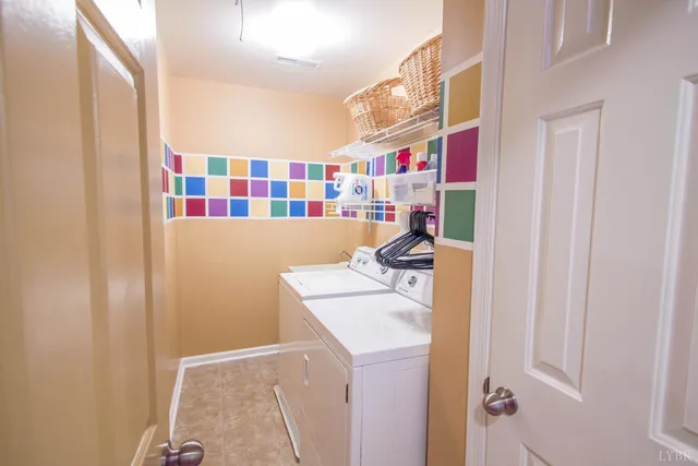 a view of a livingroom with furniture and staircase