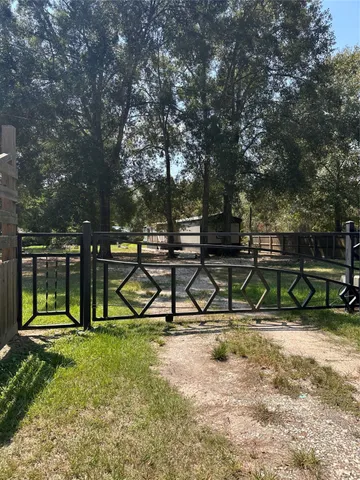 a view of park with wooden fence