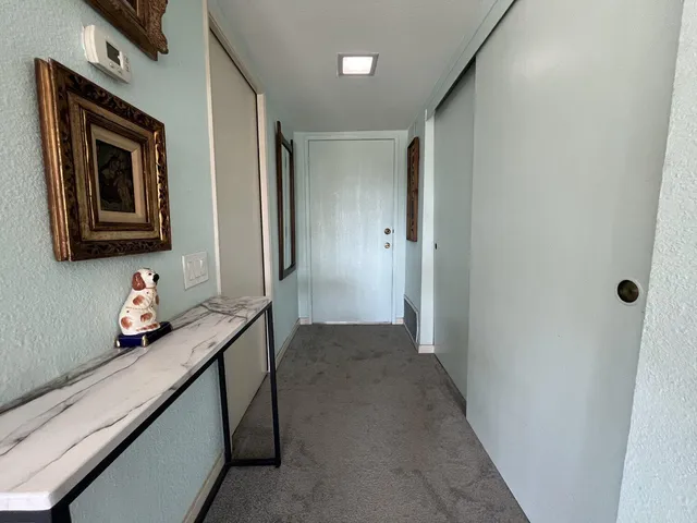 a bathroom with a toilet a sink and a large mirror