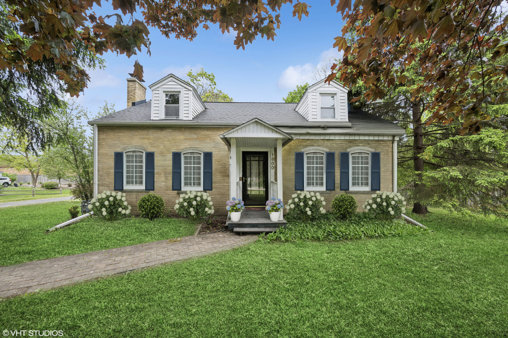 1800 Shermer Road Northbrook, IL 60062 - Photo 1 of 21 a front view of a house with garden