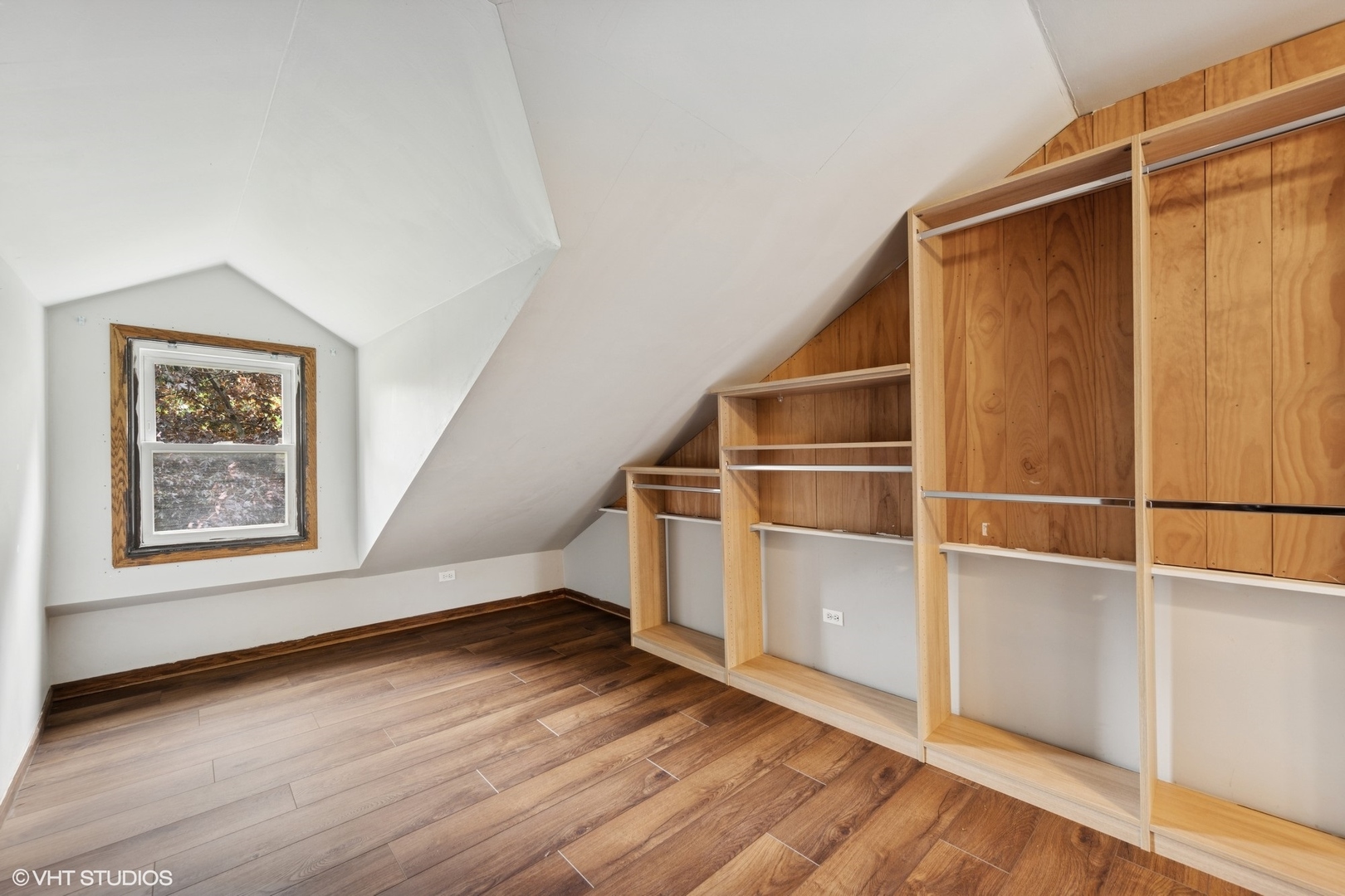 1800 Shermer Road Northbrook, IL 60062 - Photo 8 of 21 a view of an empty room with wooden floor and a window
