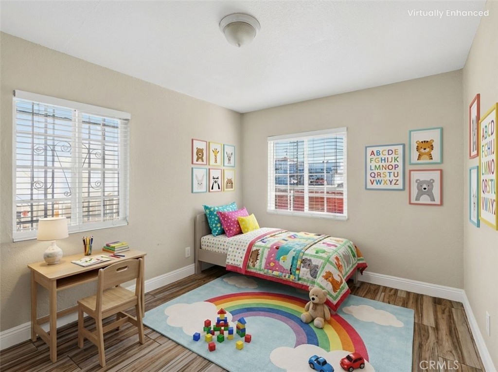 806 West Spruce Street Compton, CA 90220 - Photo 13 of 41 a bedroom with bed and a window