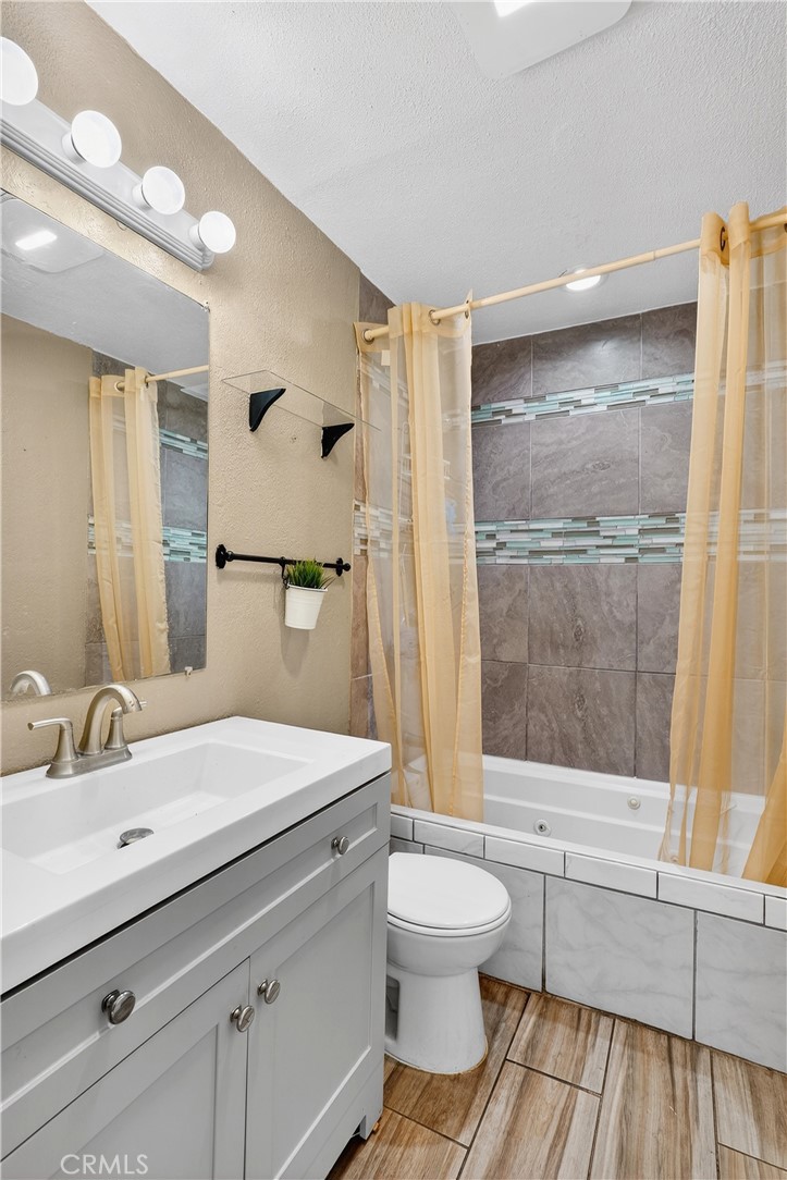 806 West Spruce Street Compton, CA 90220 - Photo 20 of 41 a bathroom with a sink a toilet and shower