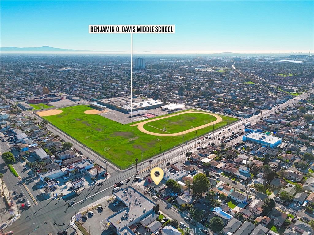 806 West Spruce Street Compton, CA 90220 - Photo 34 of 41 a view of a tennis ground with a large pool