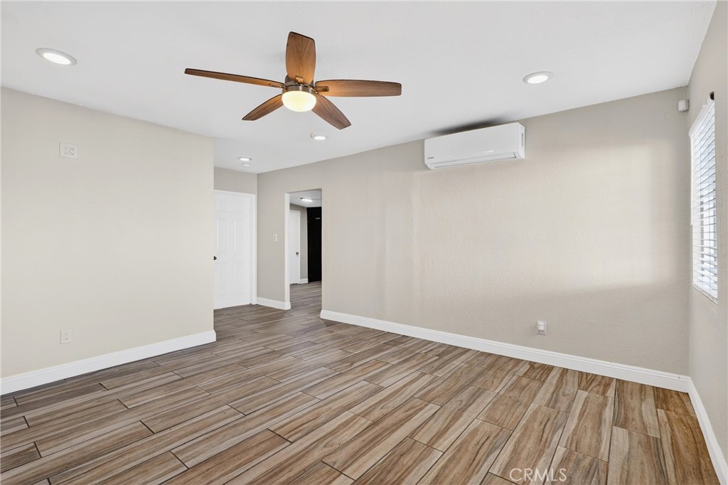 806 West Spruce Street Compton, CA 90220 - Photo 6 of 41 wooden floor in an empty room with a window