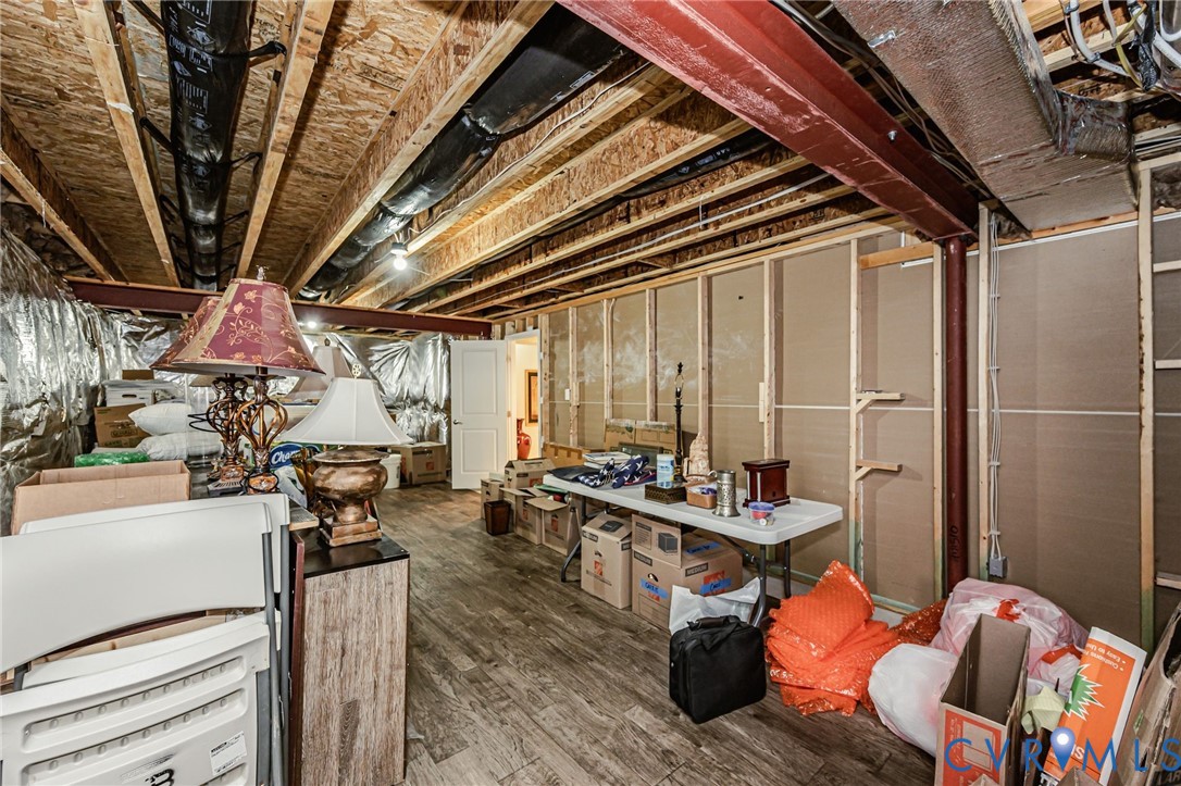 7435 Wicks Road Williamsburg, VA 23188 - Photo 73 of 82 Unfinished basement space featuring exposed wood f