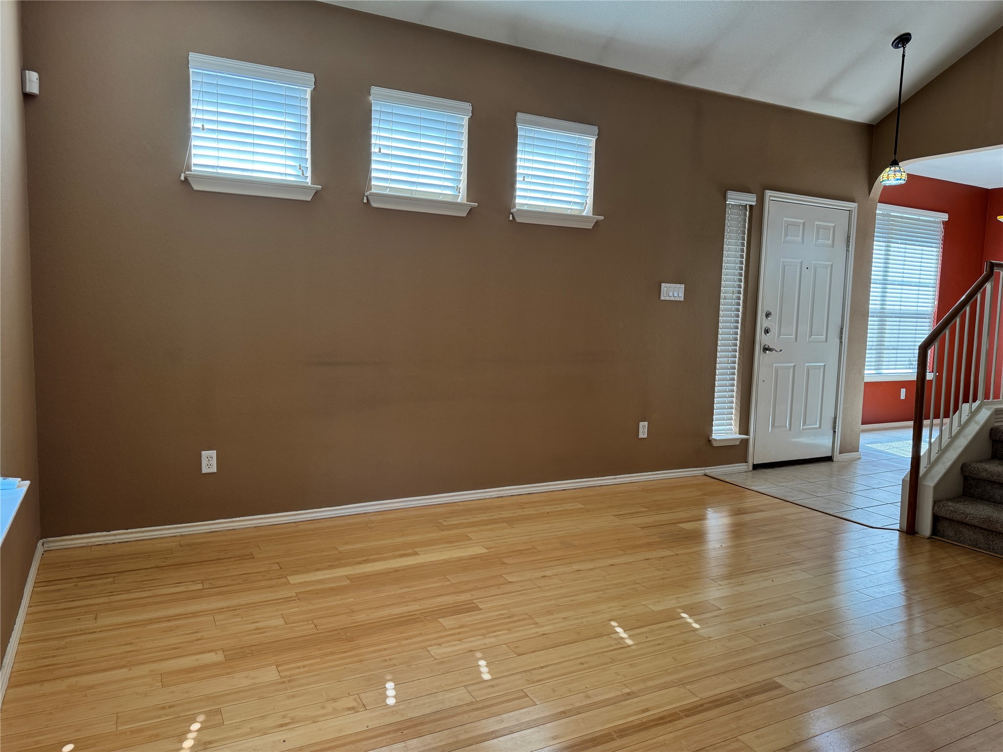 1900 Scofield Ridge Parkway, Unit 3503 Austin, TX 78727 - Photo 5 of 16 a view of an empty room with window and wooden floor