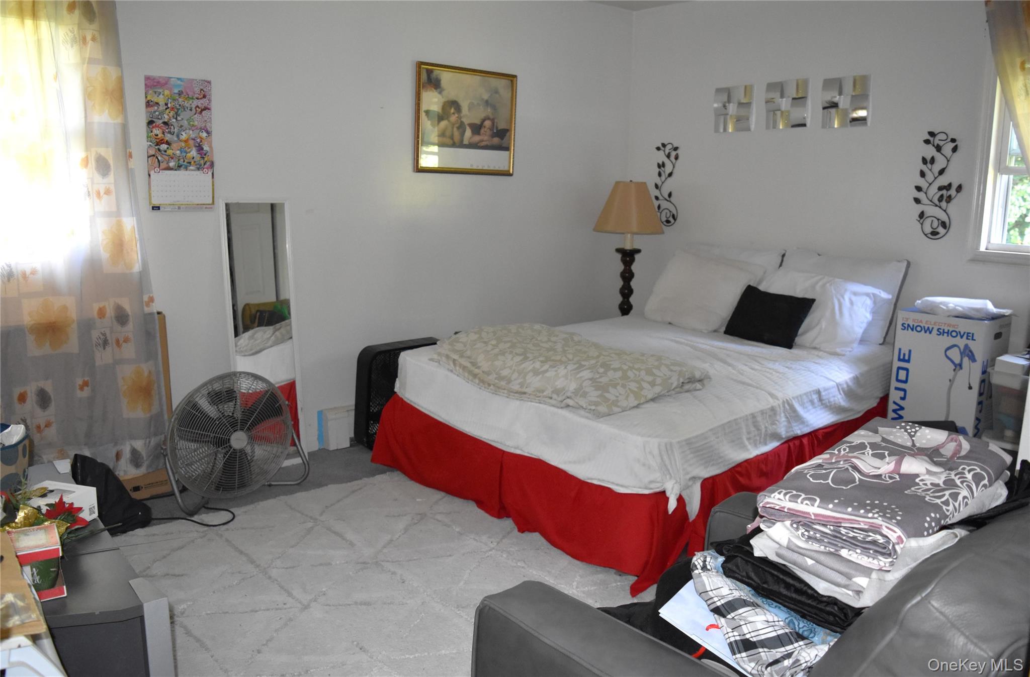 164 Brookside Farms Road Newburgh, NY 12550 - Photo 11 of 18 a bedroom with a bed and painting on the wall