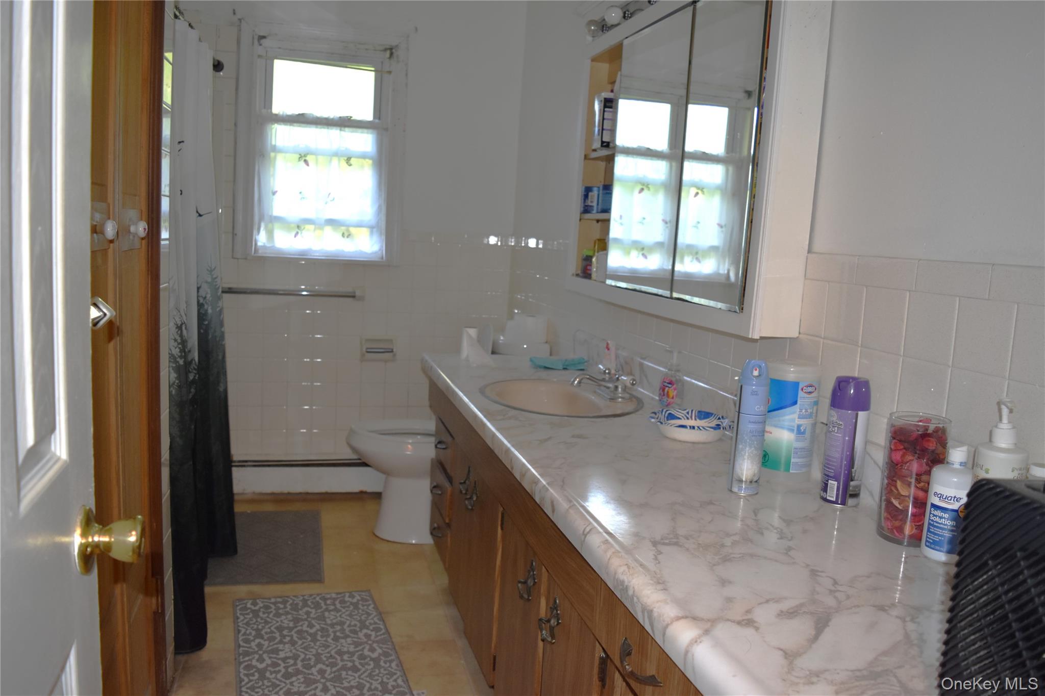 164 Brookside Farms Road Newburgh, NY 12550 - Photo 13 of 18 a bathroom with a granite countertop sink a toilet and a shower