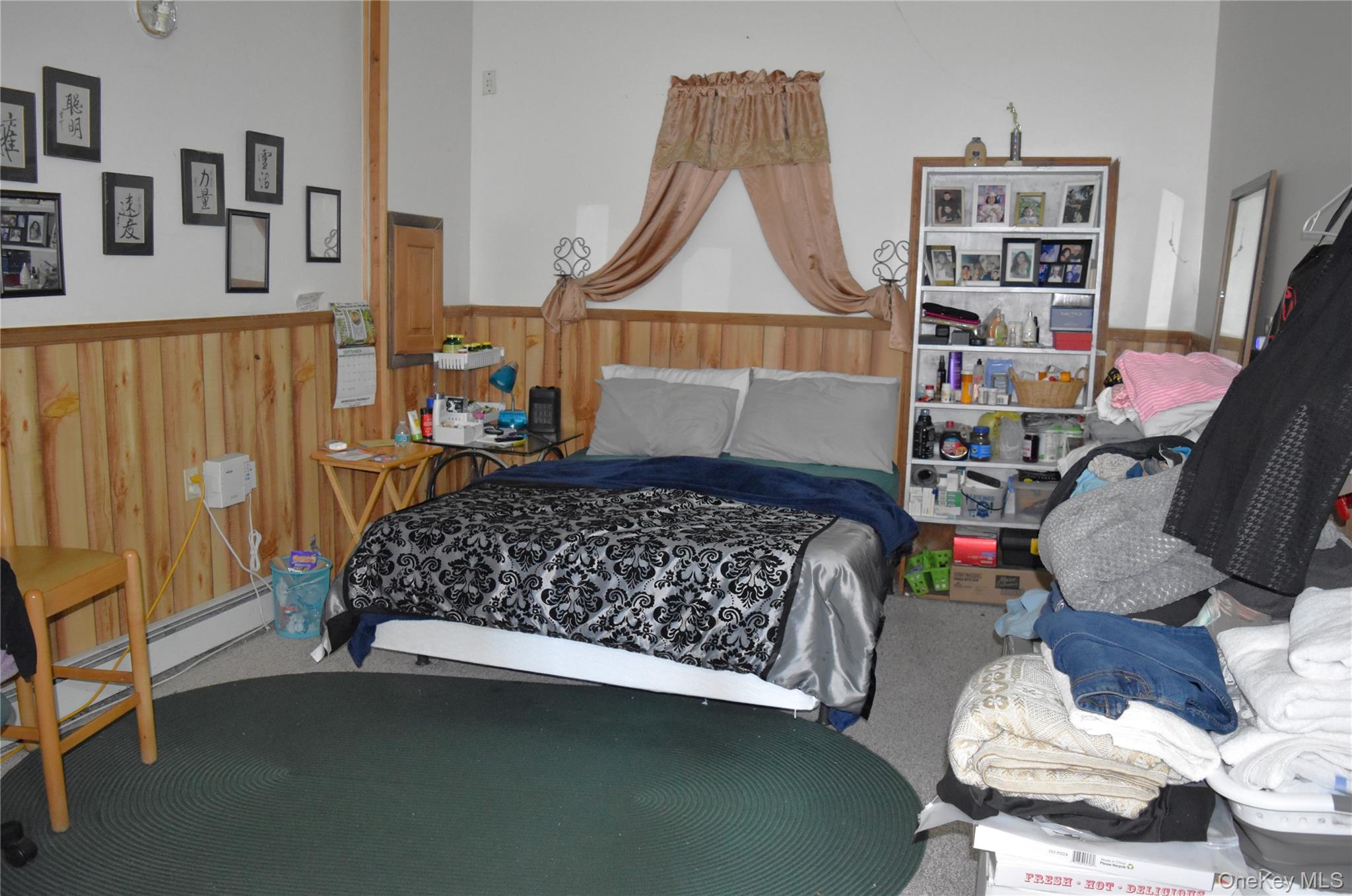 164 Brookside Farms Road Newburgh, NY 12550 - Photo 15 of 18 a bedroom with a bed and a wooden floor