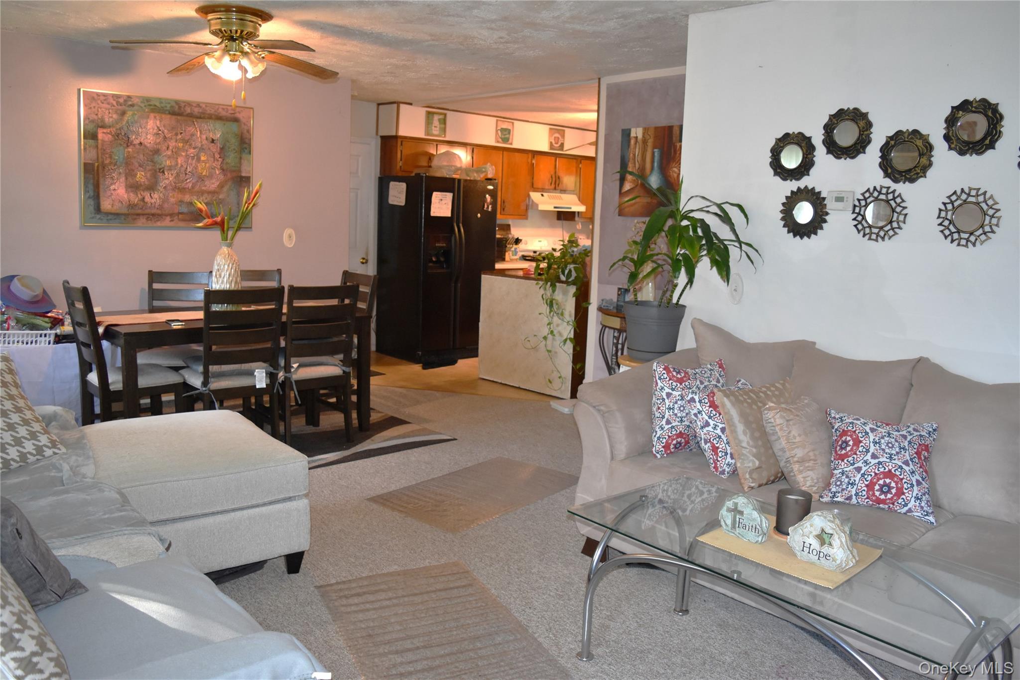 164 Brookside Farms Road Newburgh, NY 12550 - Photo 3 of 18 a living room with furniture and a flat screen tv