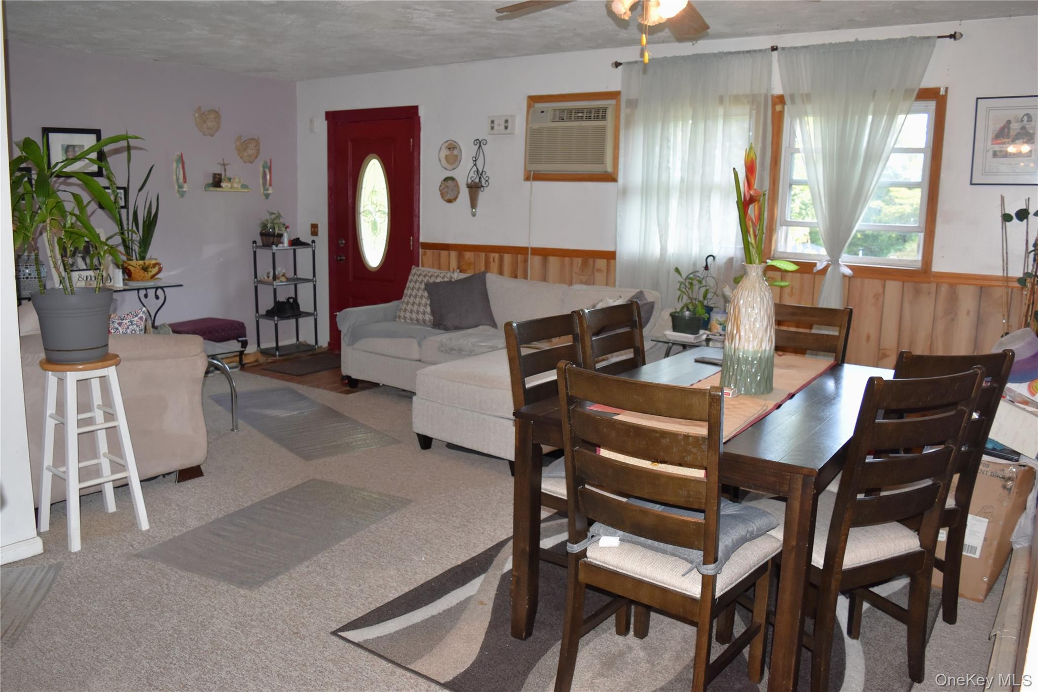164 Brookside Farms Road Newburgh, NY 12550 - Photo 6 of 18 a living room with furniture a dining table a lamp and a potted plant