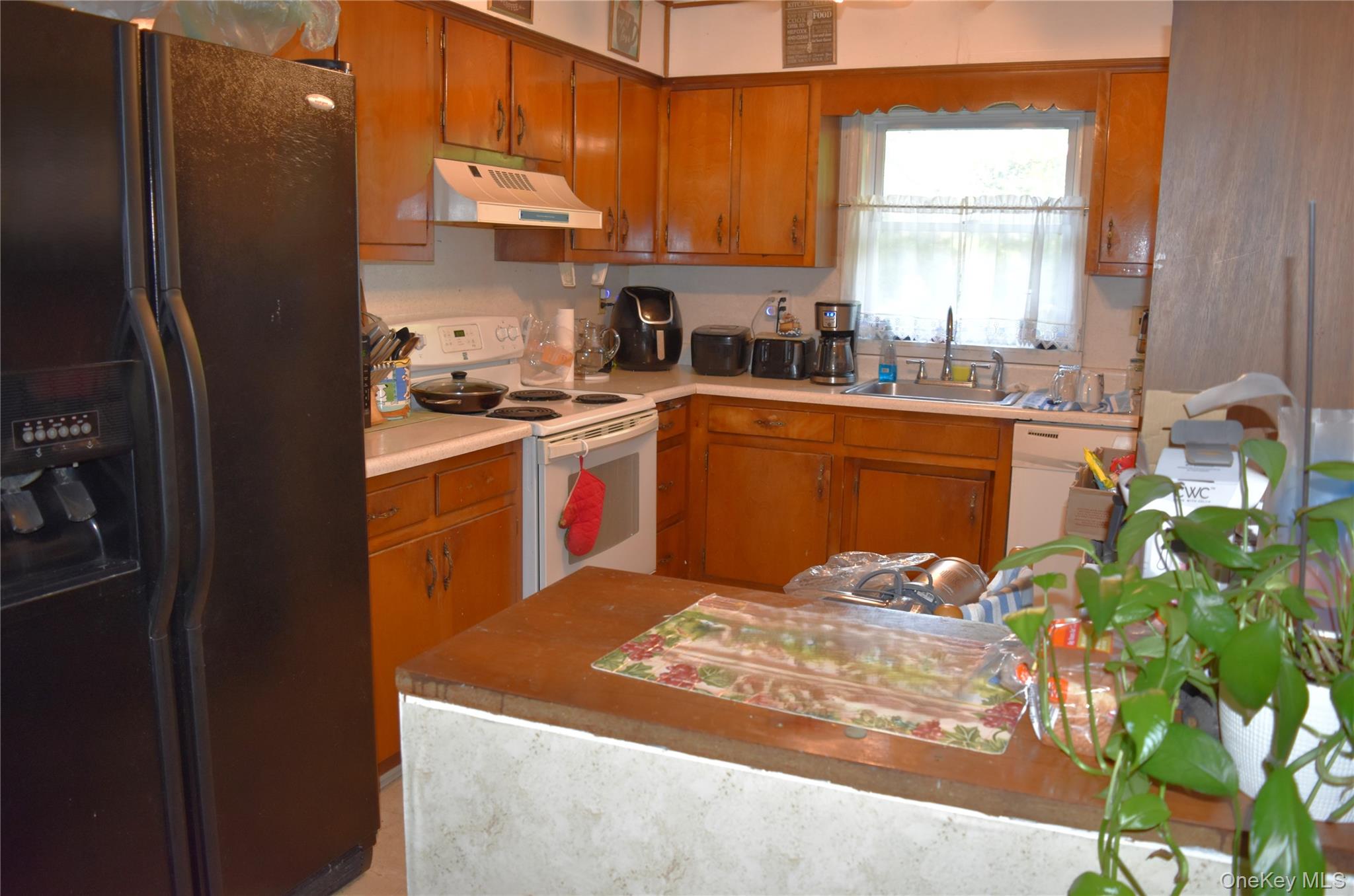 164 Brookside Farms Road Newburgh, NY 12550 - Photo 9 of 18 a kitchen with stainless steel appliances granite countertop a refrigerator sink and cabinets