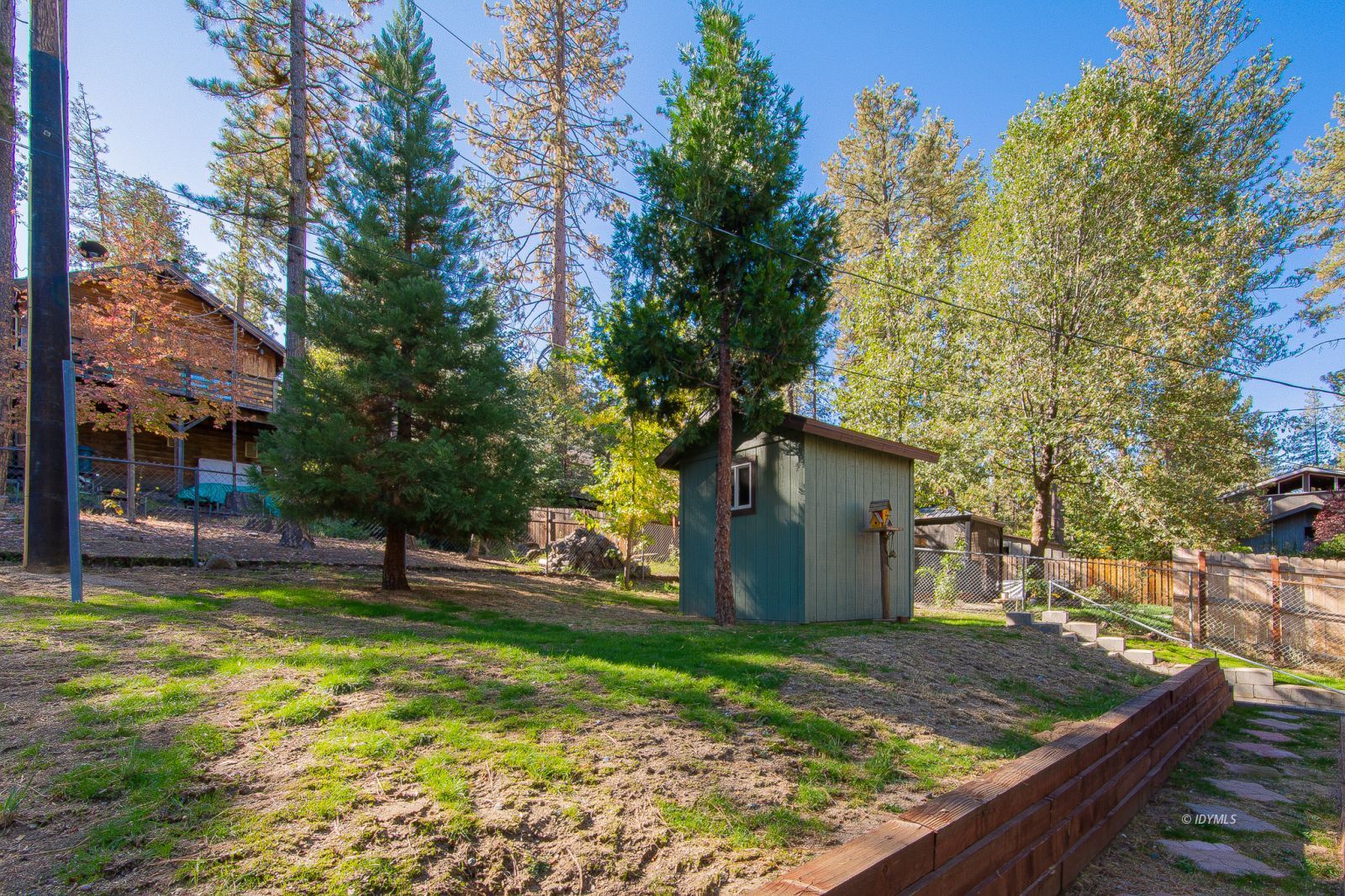 53545 Tollgate Road Idyllwild, CA 92549 - Photo 21 of 30 a view of a house with a yard patio and tree