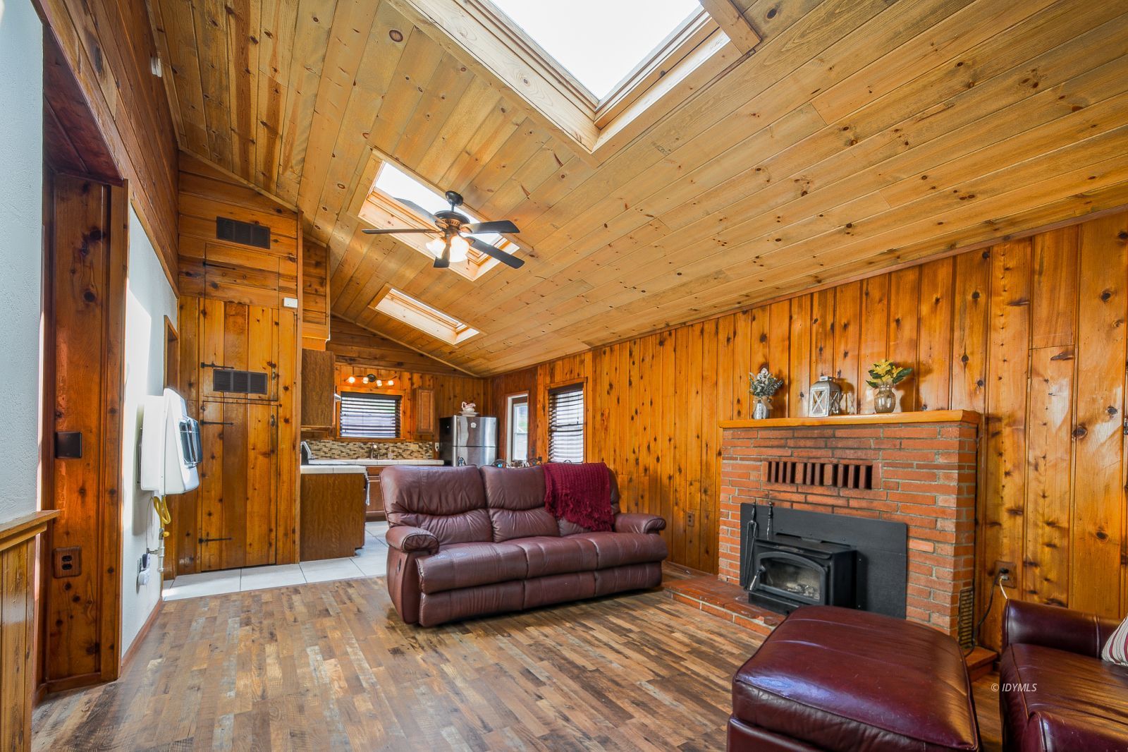 53545 Tollgate Road Idyllwild, CA 92549 - Photo 4 of 30 a living room with furniture a fireplace and a flat screen tv