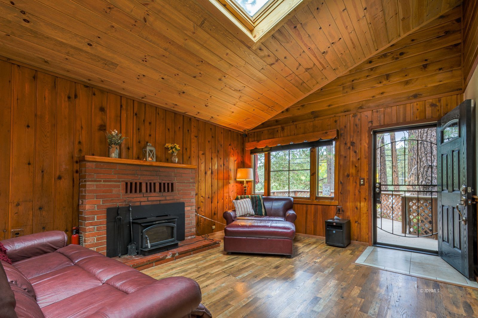 53545 Tollgate Road Idyllwild, CA 92549 - Photo 5 of 30 a living room with furniture a fireplace and a potted plant
