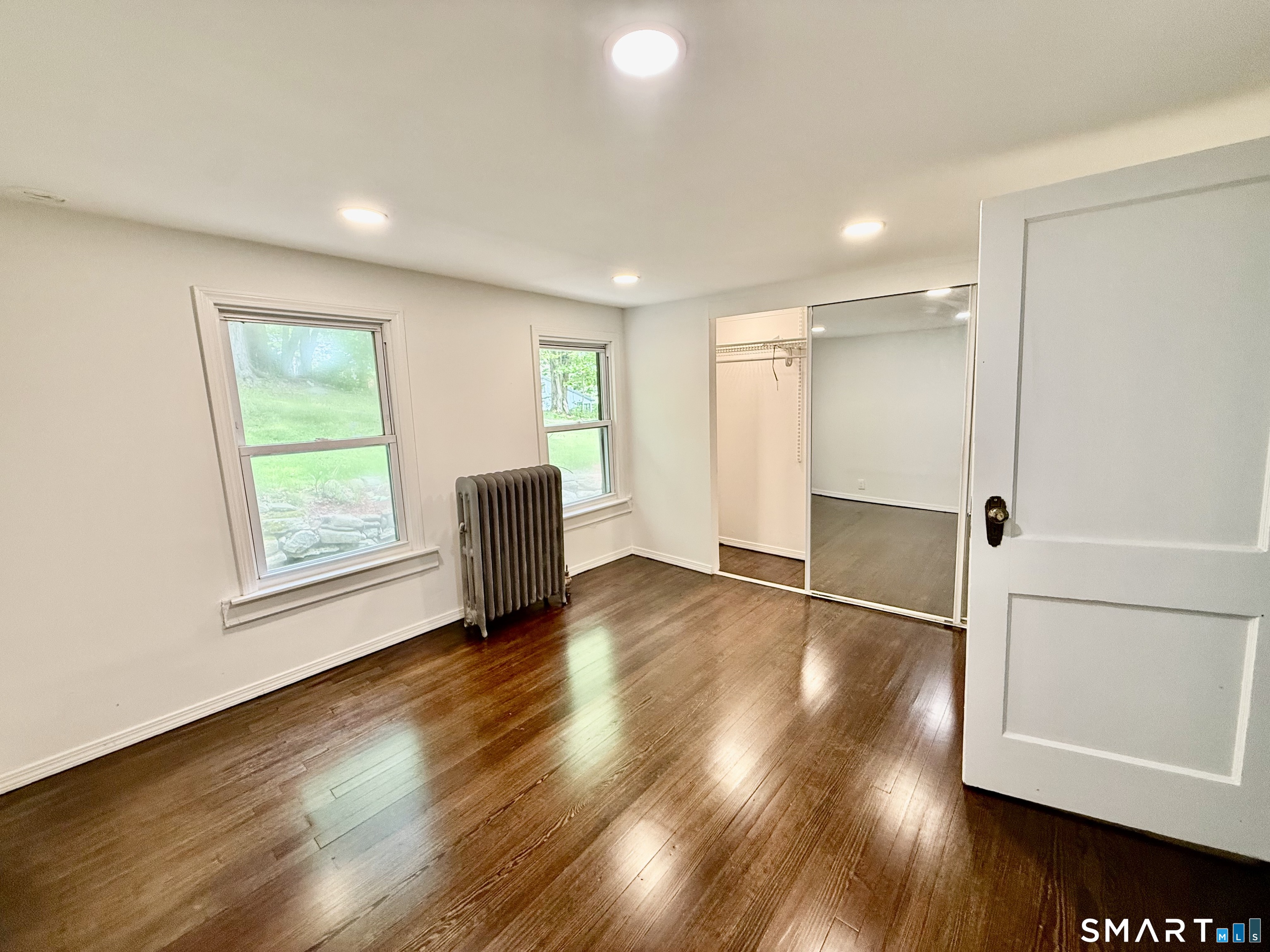 277 Lake Road Andover, CT 06232 - Photo 9 of 18 a view of empty room with wooden floor and fan