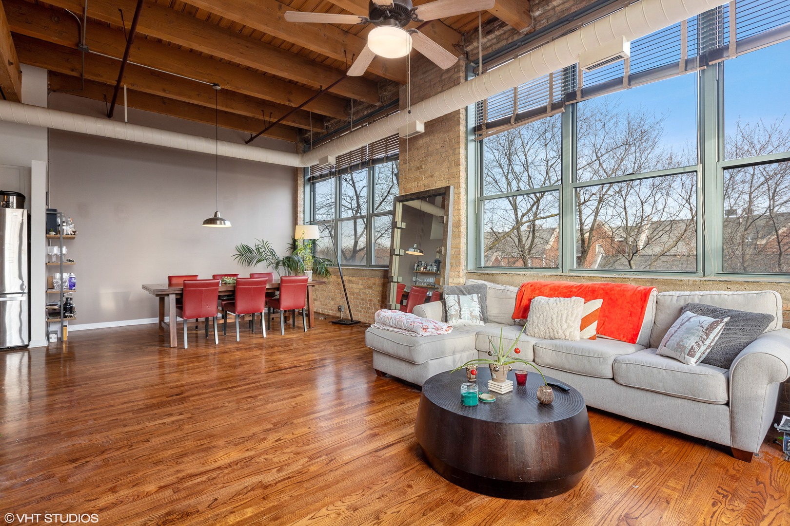 1733 West Irving Park Road, Unit 403 Chicago, IL 60613 - Photo 2 of 11 a living room with furniture and a large window