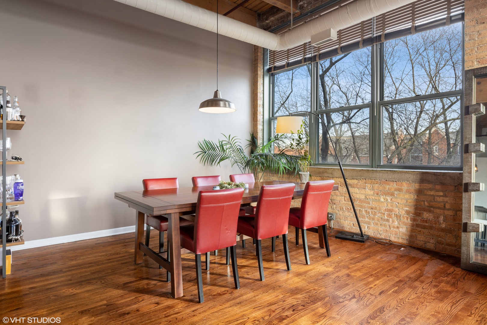 1733 West Irving Park Road, Unit 403 Chicago, IL 60613 - Photo 5 of 11 a dining room with furniture and window