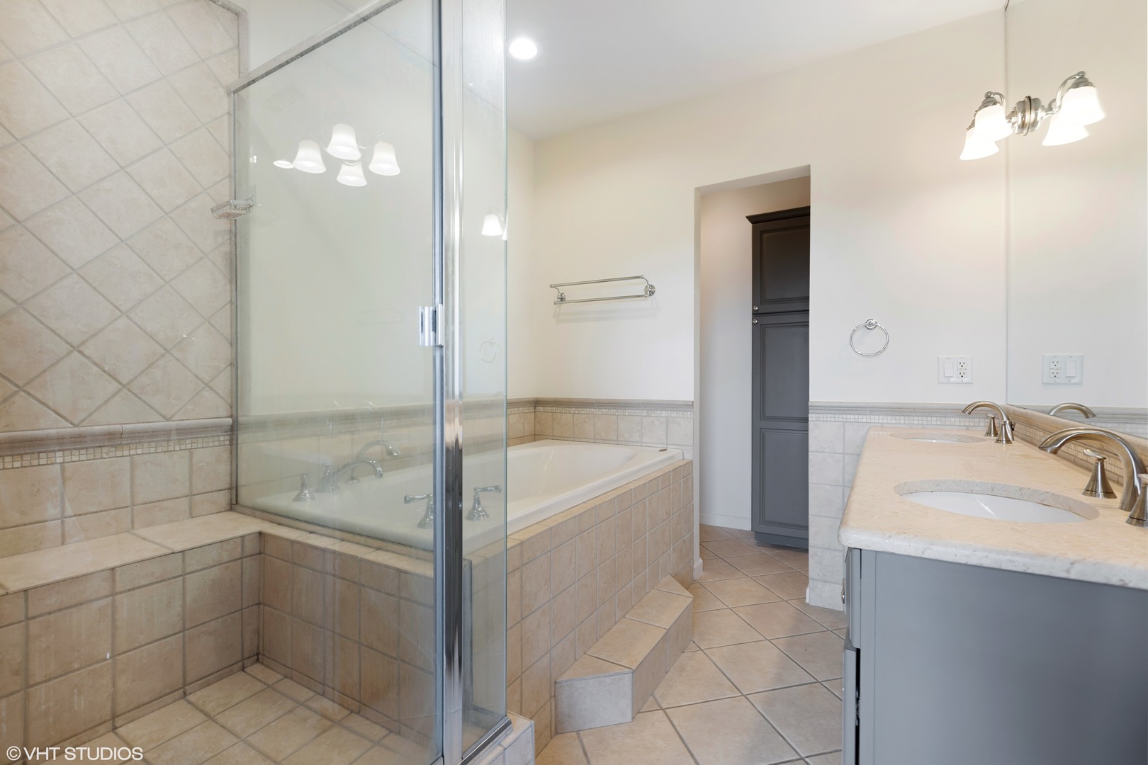1733 West Irving Park Road, Unit 403 Chicago, IL 60613 - Photo 7 of 11 a bathroom with a tub shower and sink