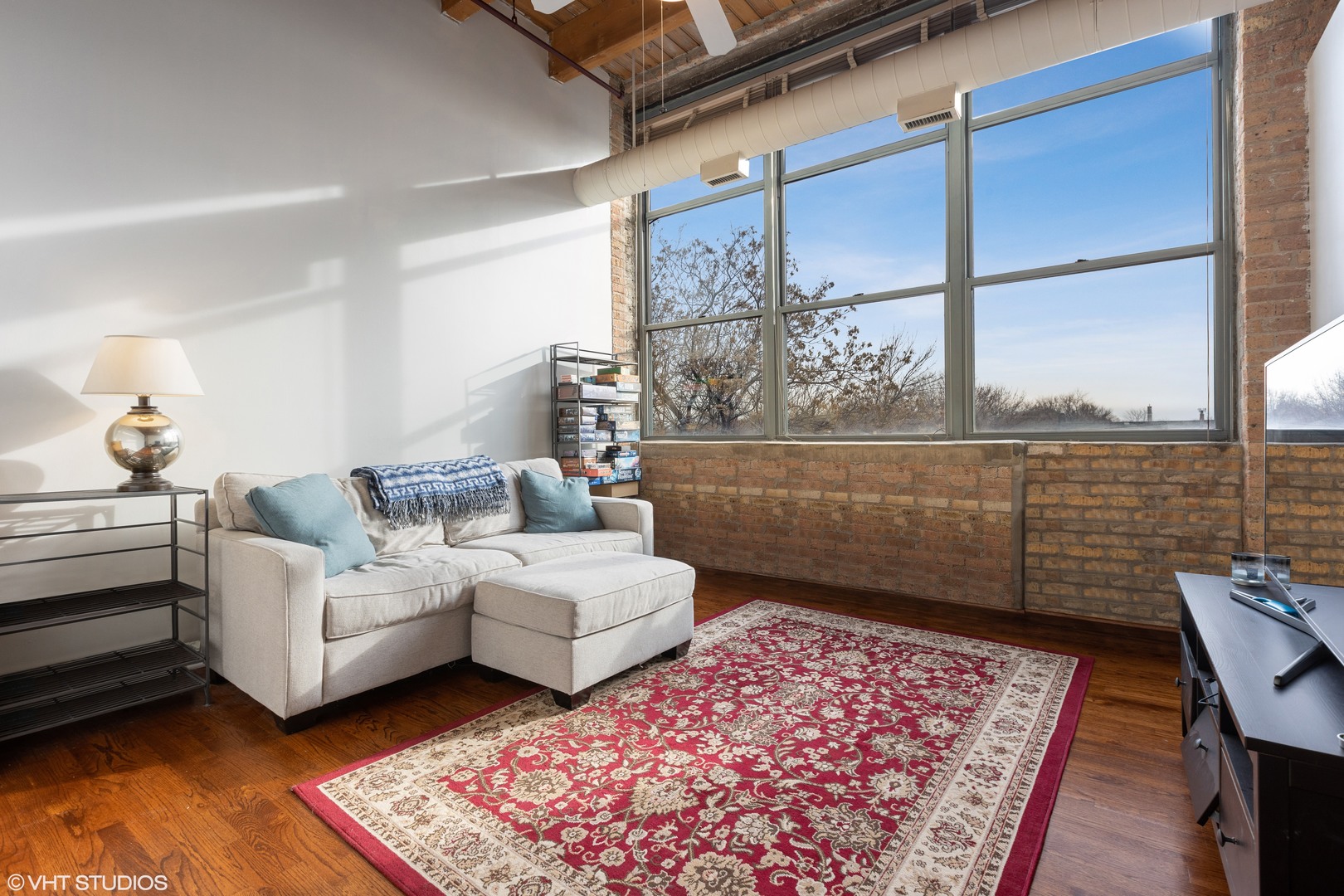 1733 West Irving Park Road, Unit 403 Chicago, IL 60613 - Photo 9 of 11 a living room with furniture
