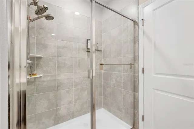 a bathroom with a toilet and a shower curtain