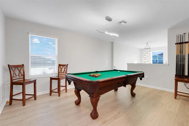 a spacious bathroom with a double vanity sink a mirror and a shower