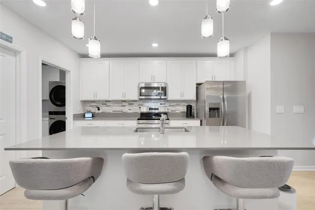 a view of a livingroom with furniture and a flat screen tv