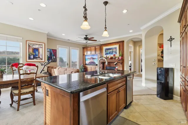 a kitchen with counter top space and stainless steel appliances
