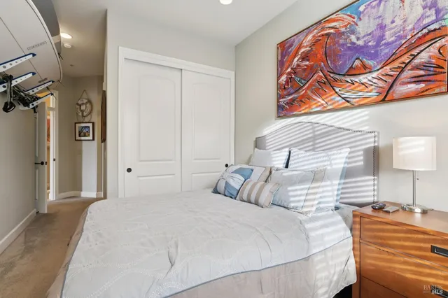 a bedroom with a bed and a lamp