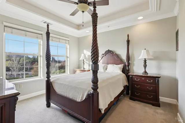 a bed sitting in a room next to a window