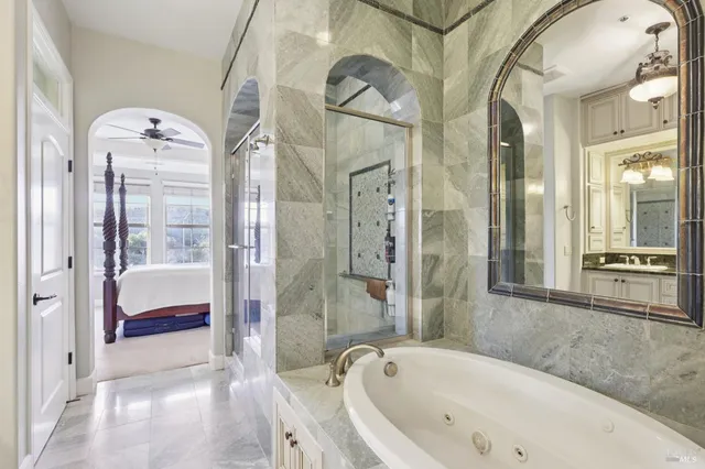 a bathroom with a bathtub and a shower