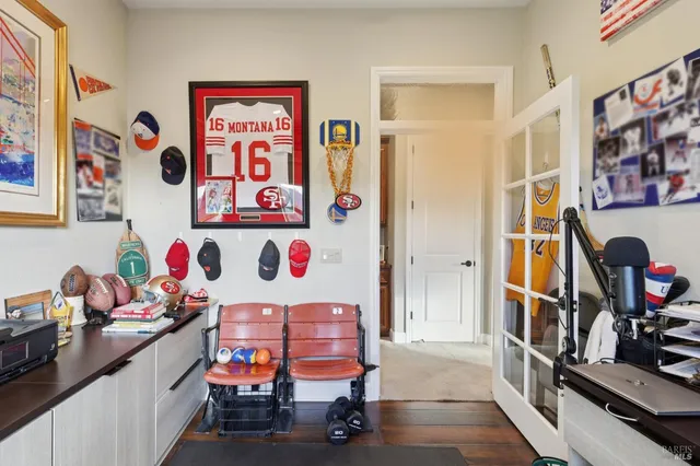 a view of a hallway with workspace and toys