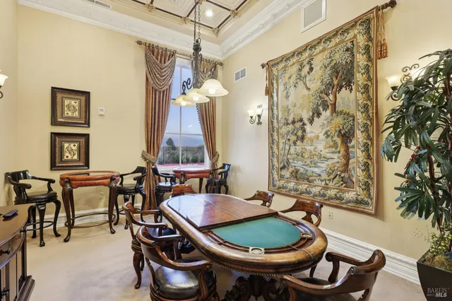 a dining room with a table and chairs