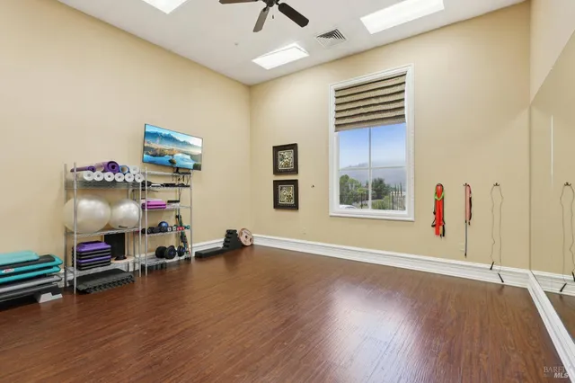 a view of room with lounge chair and wooden floor