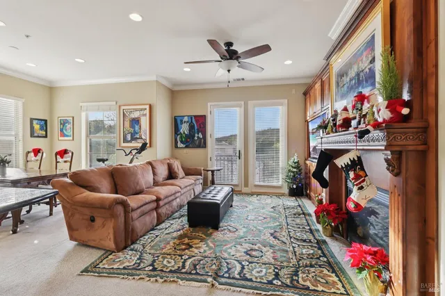 a living room with furniture chess board and a rug