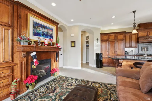a living room with fireplace furniture and a flat screen tv